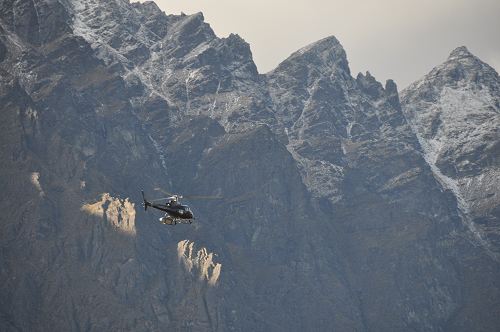 Helicopter against the backdrop of the Remarkables, near Queenstown
