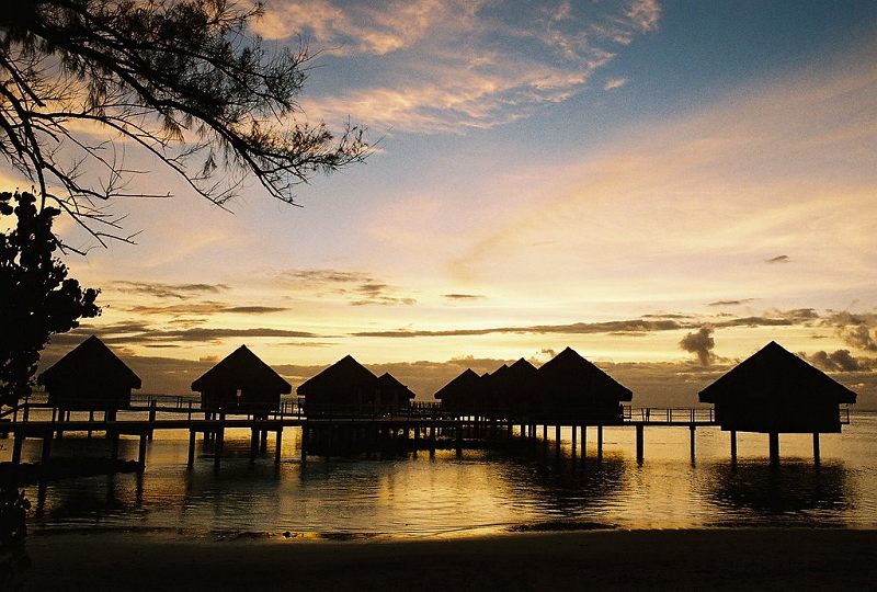 Overwater bungalows at sunset, Le Meridien, on Tahiti Nui
