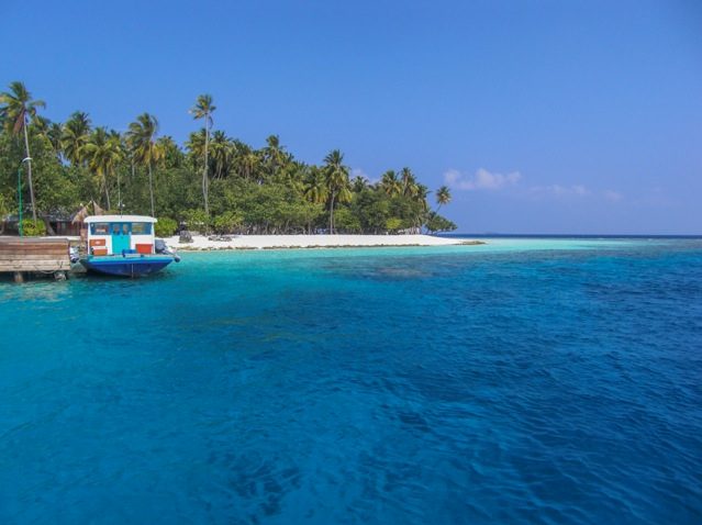 Boat docked on the atoll in the Maldives.