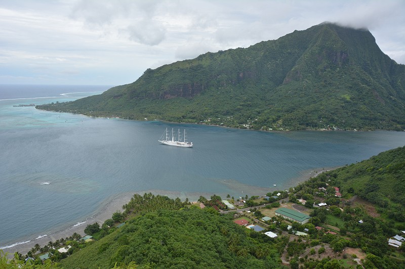 Mountains, lagoon, and sailing ship on the island of Moorea