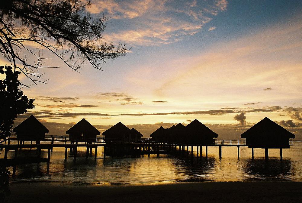 Lagoon and overwater bungalows at sunset - Le Meridien Tahiti. Copyright Michael Cottam.