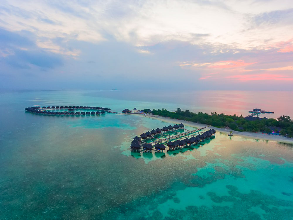 Arial Sunset View - Olhuveli Beach & Spa Maldives. Copyright Olhuveli Beach.